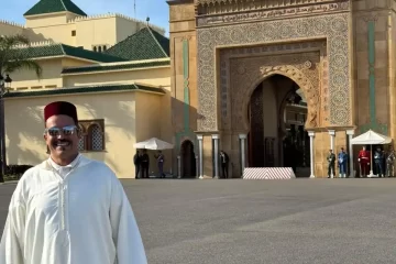 Local guide in traditional djellaba and fez hat at the Royal Palace during a Half Day Rabat City Tour