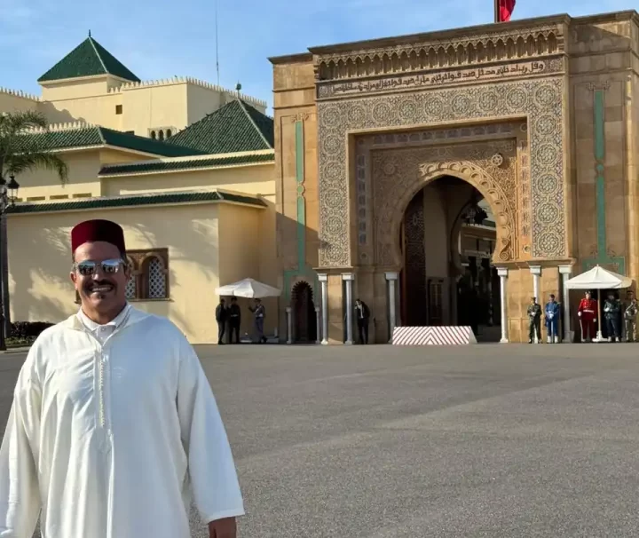 Local guide in traditional djellaba and fez hat at the Royal Palace during a Half Day Rabat City Tour