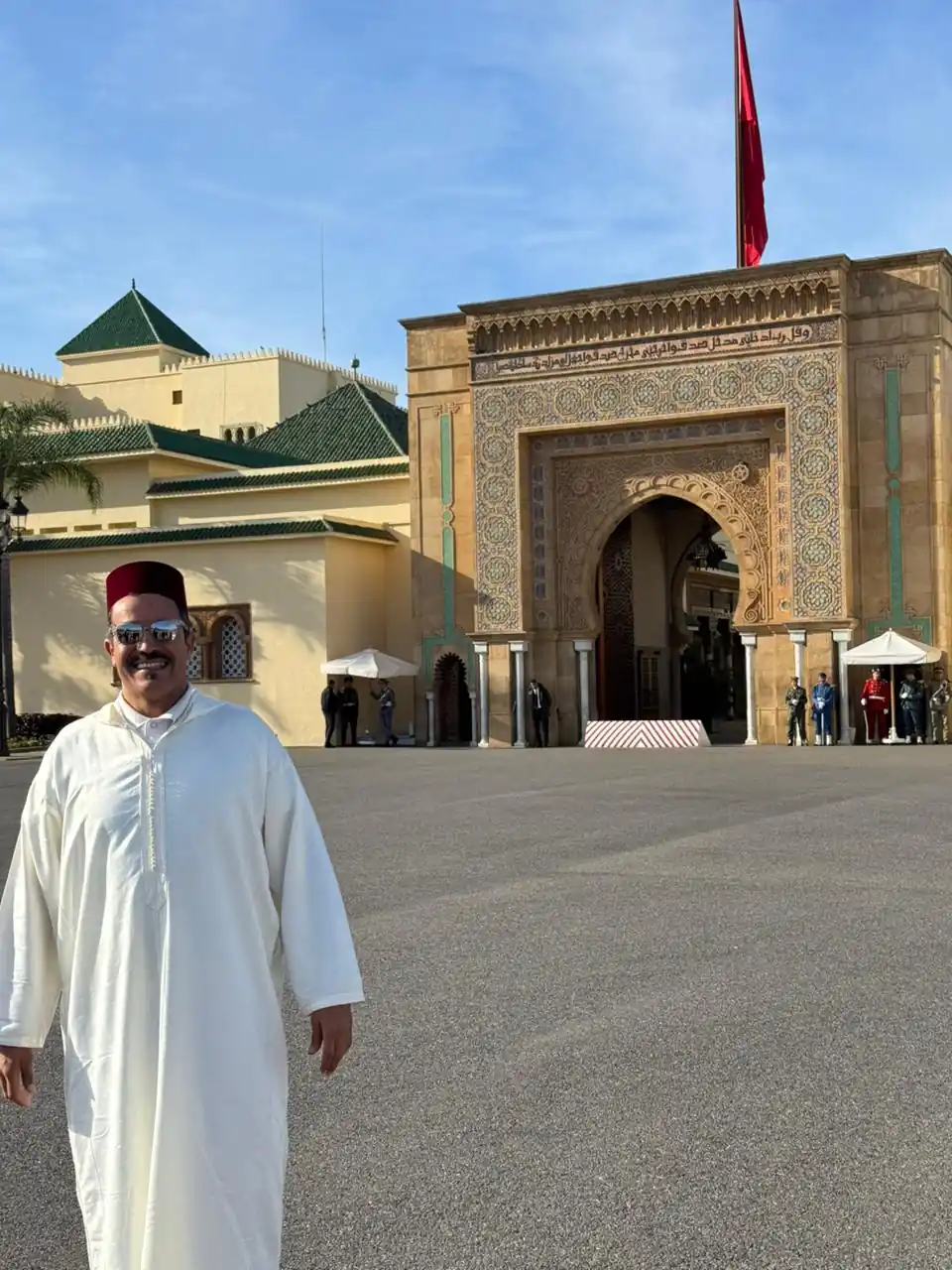 Local guide in traditional djellaba and fez hat at the Royal Palace during a Half Day Rabat City Tour